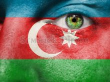 3839 flag painted on face with green eye to show azerbaijan support.jpg